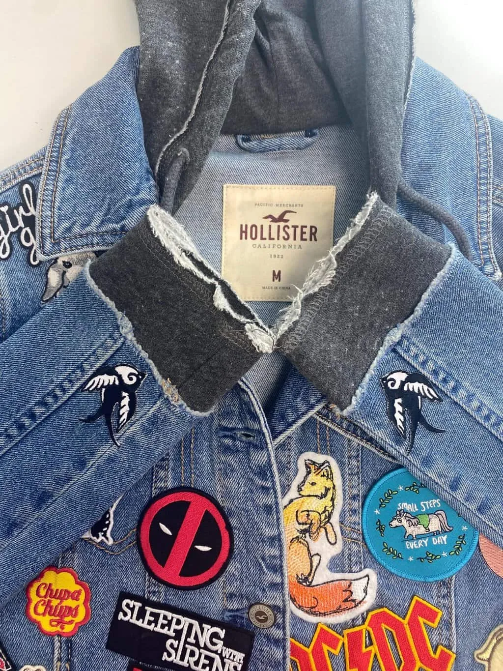 Customised Hollister hooded denim jacket with amazing patches – Small