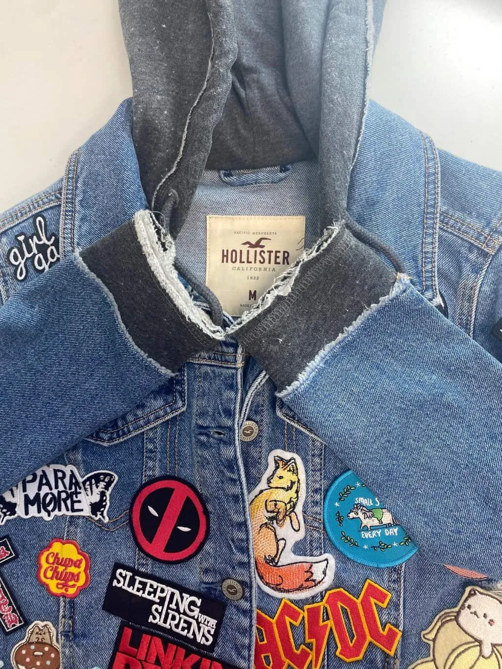 Customised Hollister hooded denim jacket with amazing patches – Small